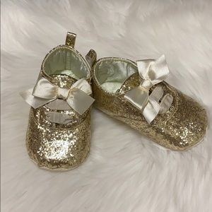 Gold baby shoes